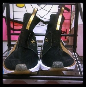 Black and Gold Puma Sneakers